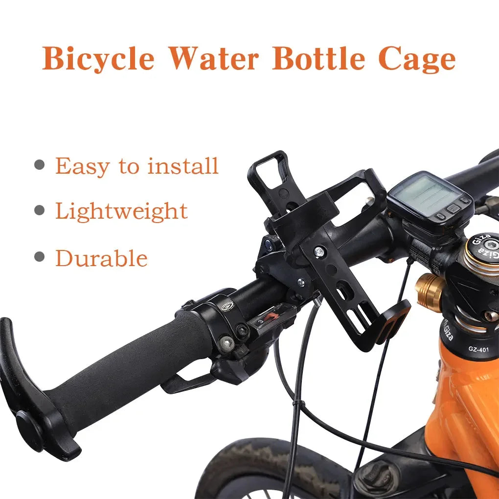 A black bicycle water bottle cage is installed on a bike frame, designed to hold water bottles.