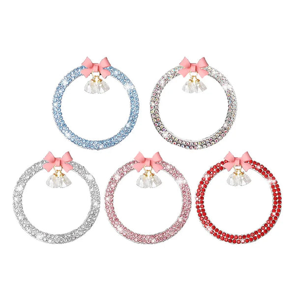 Four circular rhinestone bow bell car start switch button trims in blue, pink, and red.