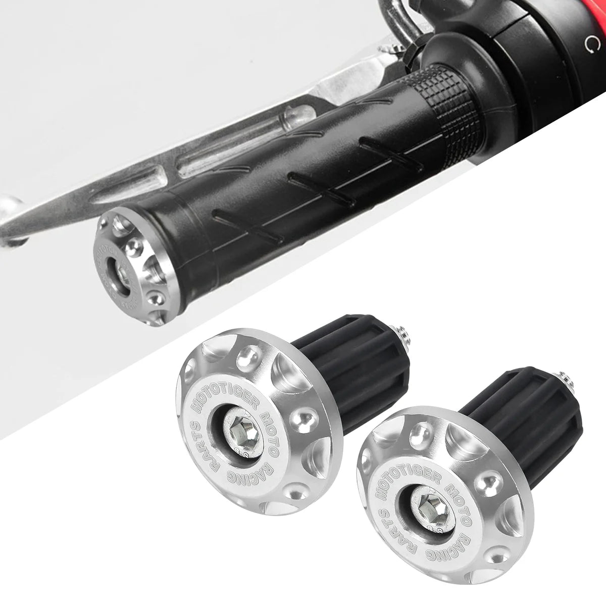 Close-up view of black motorcycle handle bar plug grips for dirt bikes with silver mounting hardware