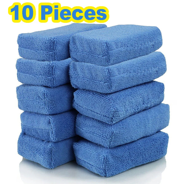 A stack of ten blue microfiber car wax applicator pads for polishing and waxing.