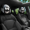 Black car seat headrest covers featuring decorative ghost faces with white fur and teeth