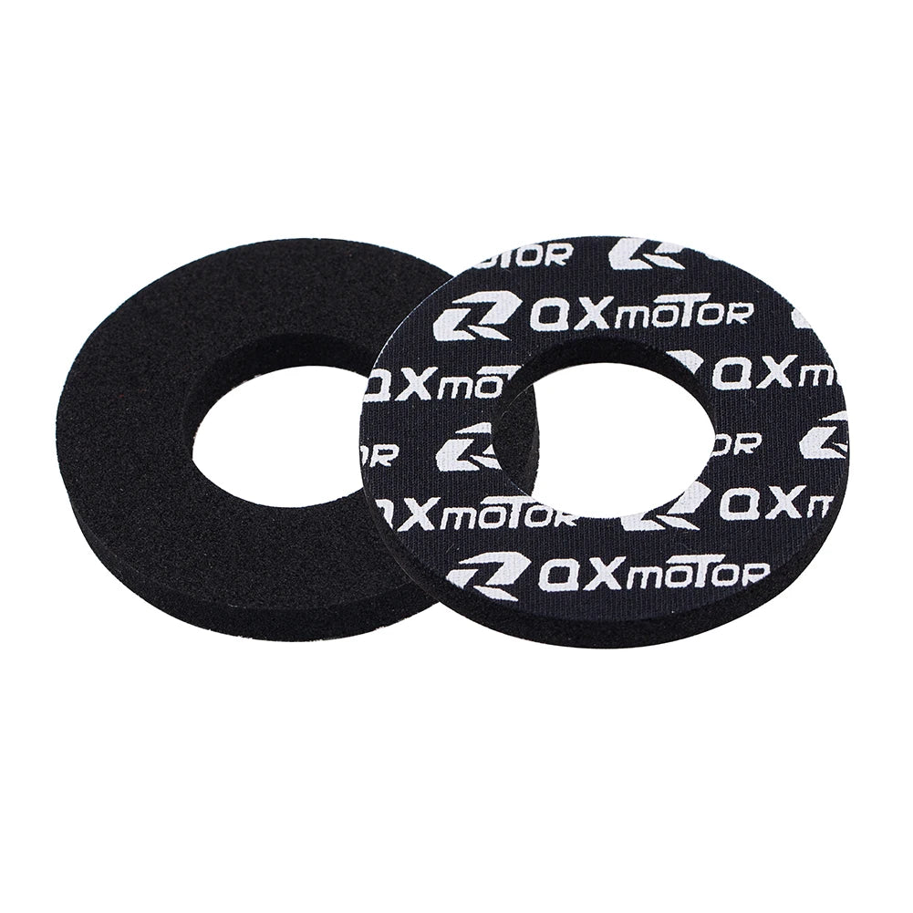 Two black gel rubber handlebar grips with white text featuring the brand name OXmotor