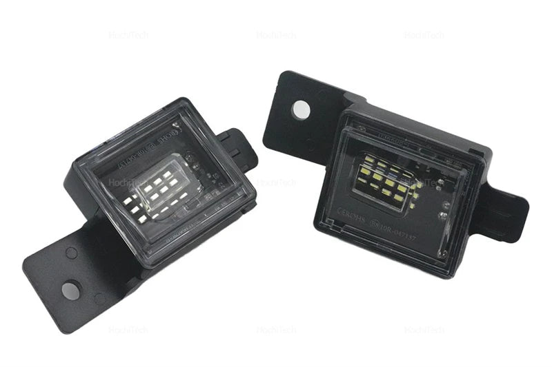 Black LED license plate lights designed for Chevy Silverado, GMC Sierra, and Canyon vehicles.