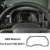 Carbon fiber grain interior trim kit for Ford F150 2021-2024 featuring a steering wheel and dashboard view.