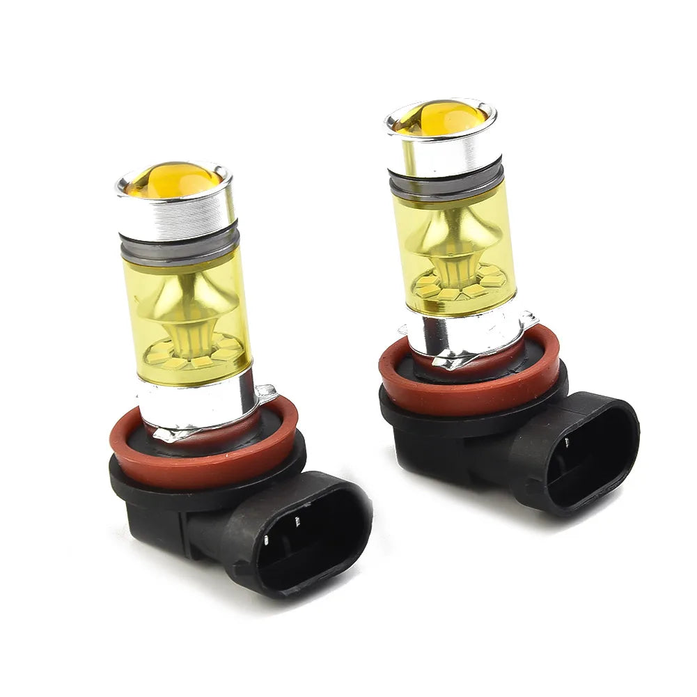 A pair of high-performance H11/H8 yellow LED fog light bulbs with silver and gold accents.