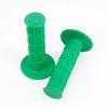 A green universal motorcycle handlebar grip with a cylindrical grip section and a flared end.