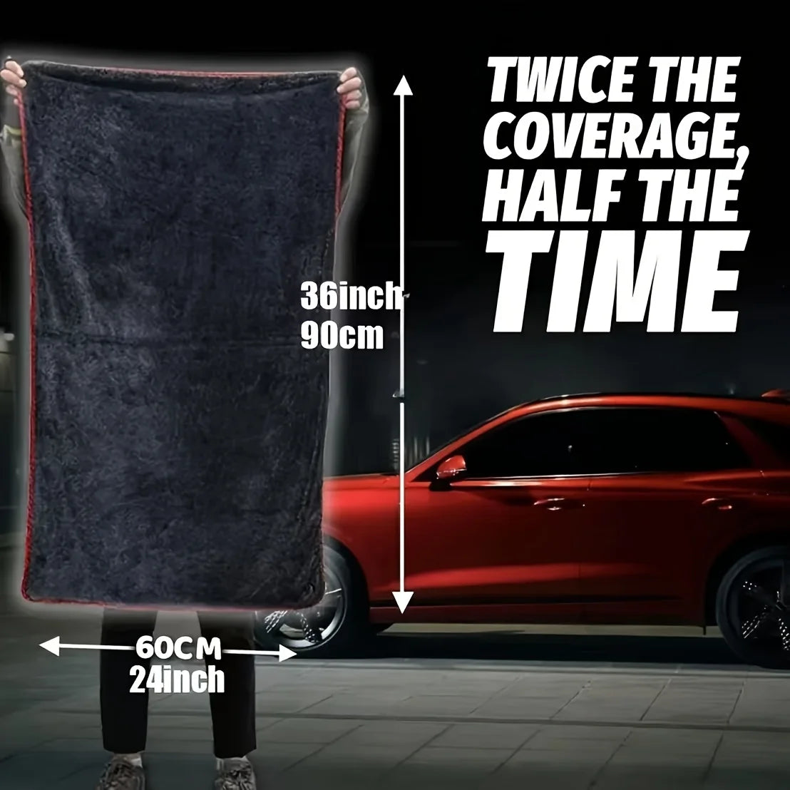 A person holds up an extra large microfiber drying towel next to a red car, demonstrating its coverage.