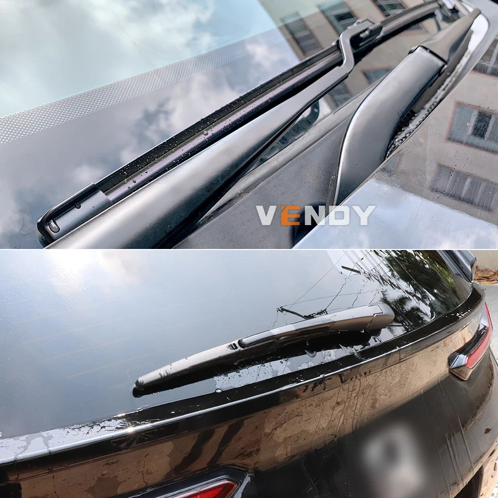Close-up view of a vehicle windshield with new universal wiper blades installed.