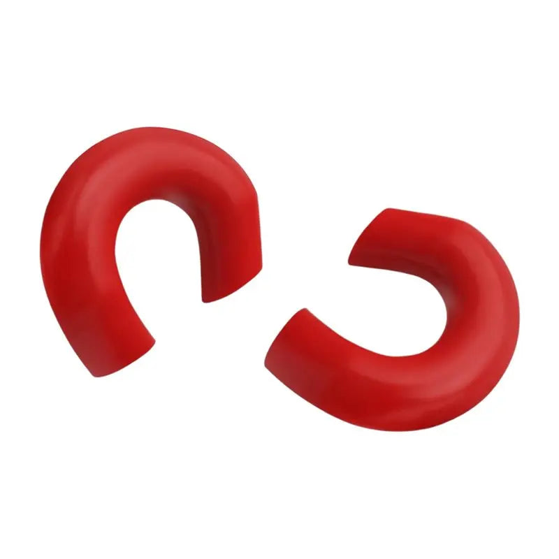 A pair of red durable tow hook covers for Ford Super Duty trucks.
