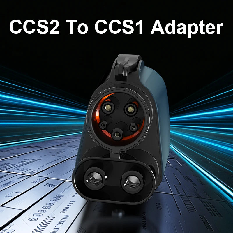 A black adapter for converting CCS2 to CCS1 electric vehicle charging plugs, shown on a technical surface.