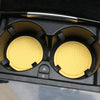 A set of decorative rhinestone car coasters in yellow and black are shown inside a black box.
