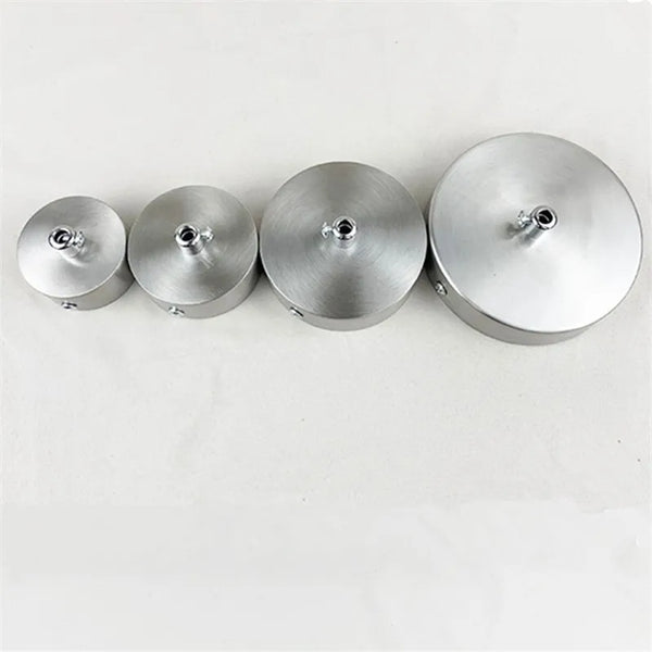 Four modern stainless steel pendant lamp bases arranged in a row.
