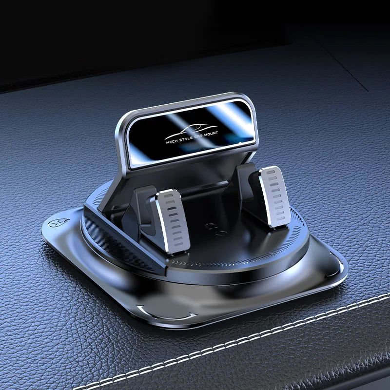 Silberne 360-Grad-drehende Handyhalterung für das Auto, auf einer dunklen Oberfläche abgestellt.