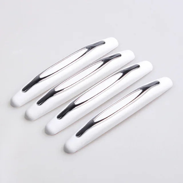 A set of white car door edge protection strips arranged diagonally on a light gray background.