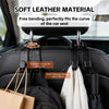 Black leather storage hooks designed for car seats, featuring a rotatable design for easy use.