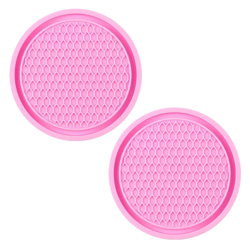 A set of pink decorative rhinestone car coasters, each featuring a hexagonal mesh design.