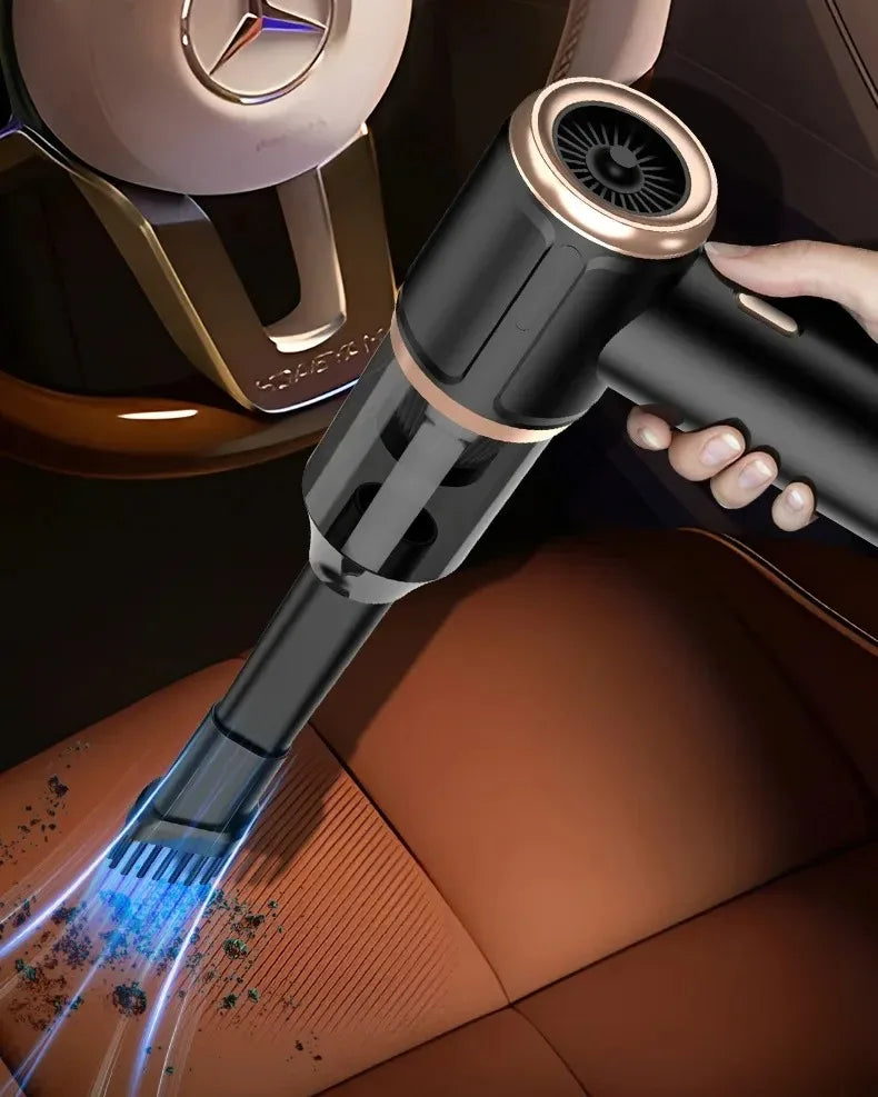 A close-up of a black portable wireless car vacuum being used to clean upholstery.