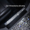 A close-up of a car rhinestone sill strip installed on the interior trim.
