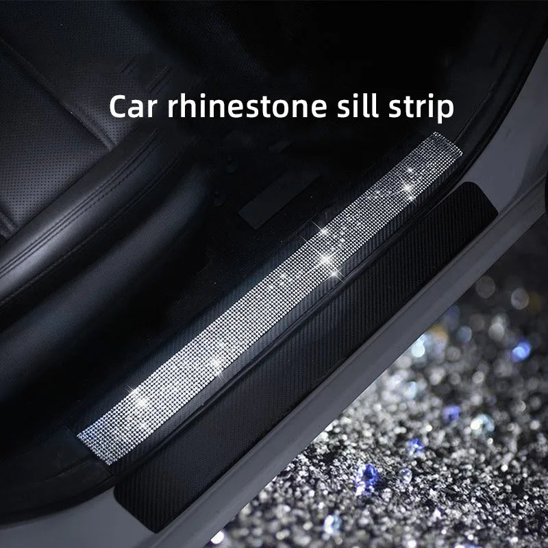 A close-up of a car rhinestone sill strip installed on the interior trim.