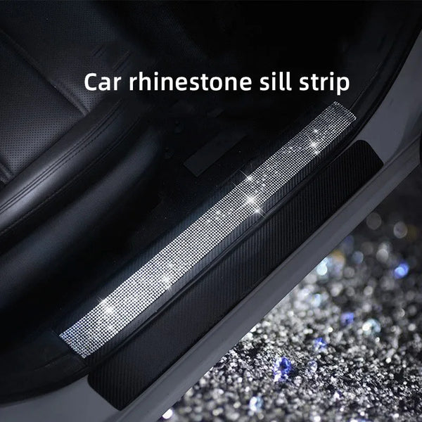 A close-up of a car rhinestone sill strip installed on the interior trim.