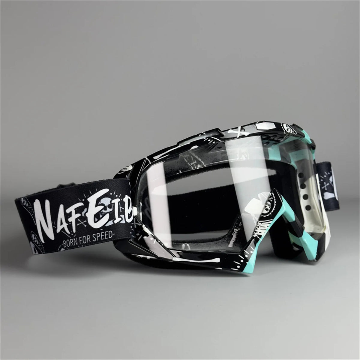 A pair of black and teal all-weather off-road motorcycle riding goggles with a white logo strap.