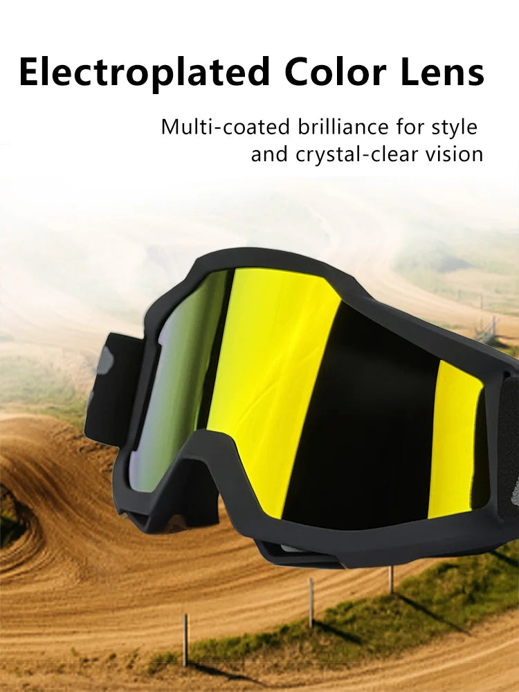 A pair of electroplated color lens goggles with a yellow tint resting on a dirt road.