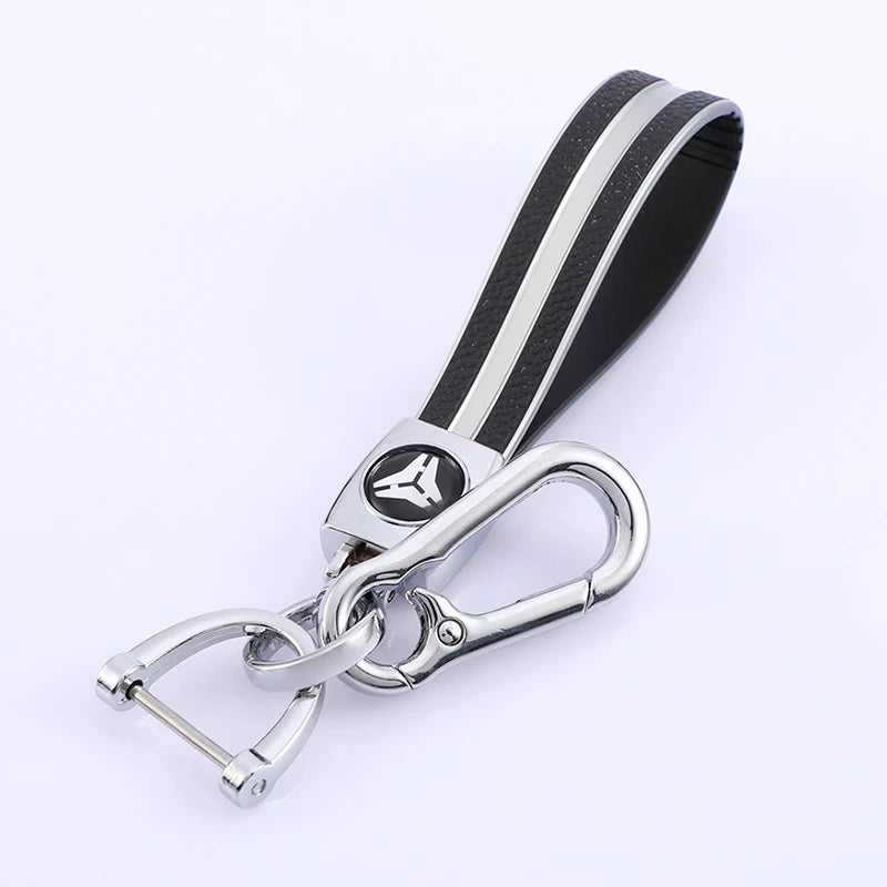 A black and silver multi-function key fob holder for automotive.