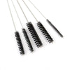 A set of five metal tools with black bristles for carburetor cleaning and maintenance.