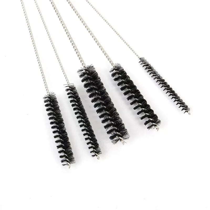 A set of five metal tools with black bristles for carburetor cleaning and maintenance.