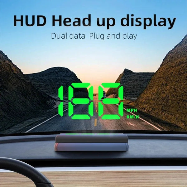 A green HUD display showing speed and distance on a road, mounted in a car dashboard.