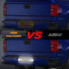 Comparison of OEM halogen and JDM style license plate lights on a blue truck tailgate.