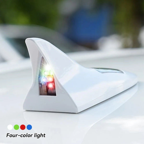 A white solar powered LED warning tail light antenna with a four-color light visible.