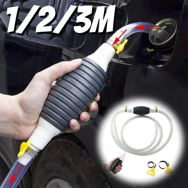 A hand is holding a manual liquid transfer pump with a flexible tube, demonstrating its use for transferring fluids.
