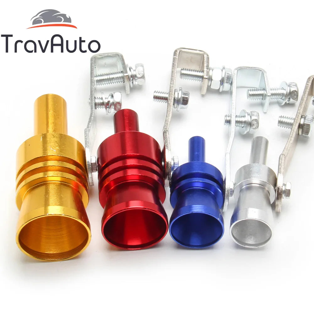 A collection of various metal turbo sound exhaust whistles and fittings in gold, red, blue, and silver.