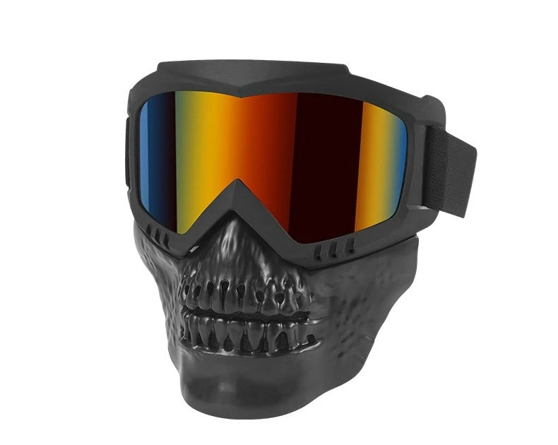 A black protective mask goggles with a skull design and a multi-colored lens is shown.