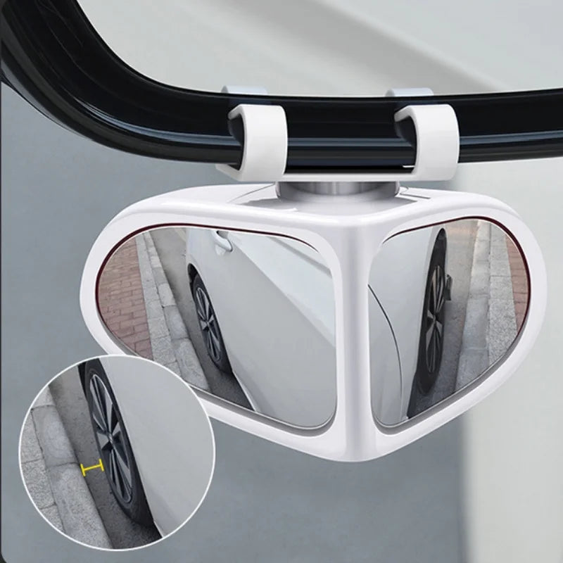 A white 360° adjustable blind spot mirror mounted on a vehicle for rearview visibility.