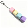 A keychain featuring five colorful, square LED buttons attached to a silver chain.