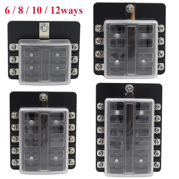 A set of six multi-way blade fuse boxes for automotive and marine systems, shown in black and silver.