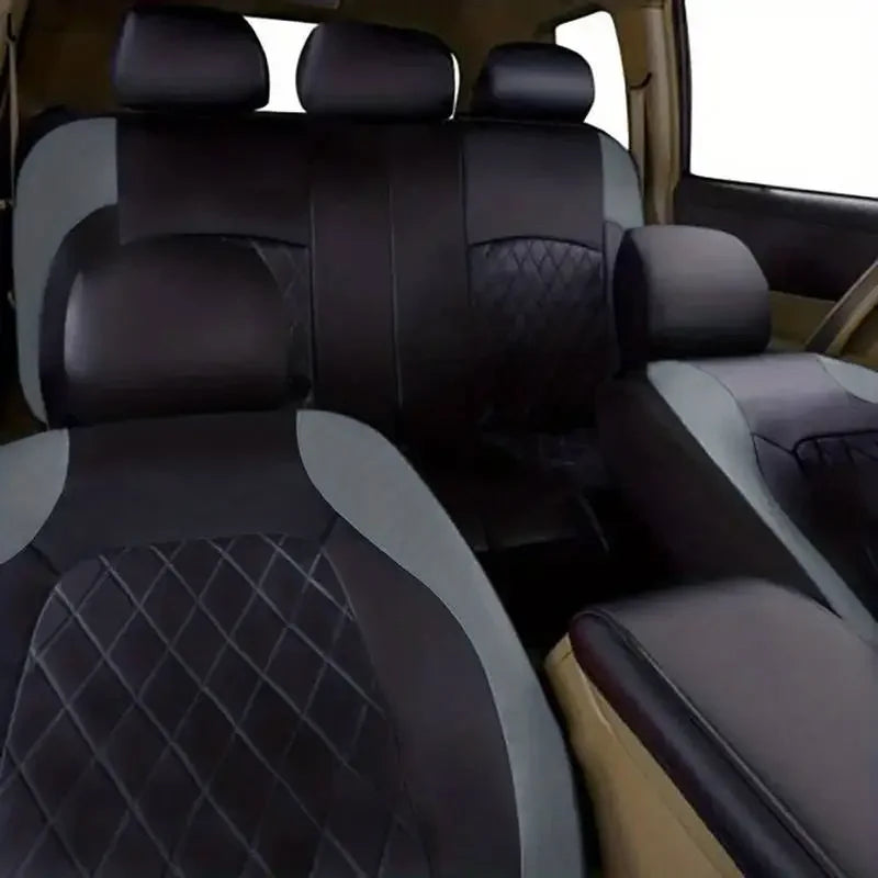 Interior view of a vehicle showing black and gray full coverage PU leather car seat covers.