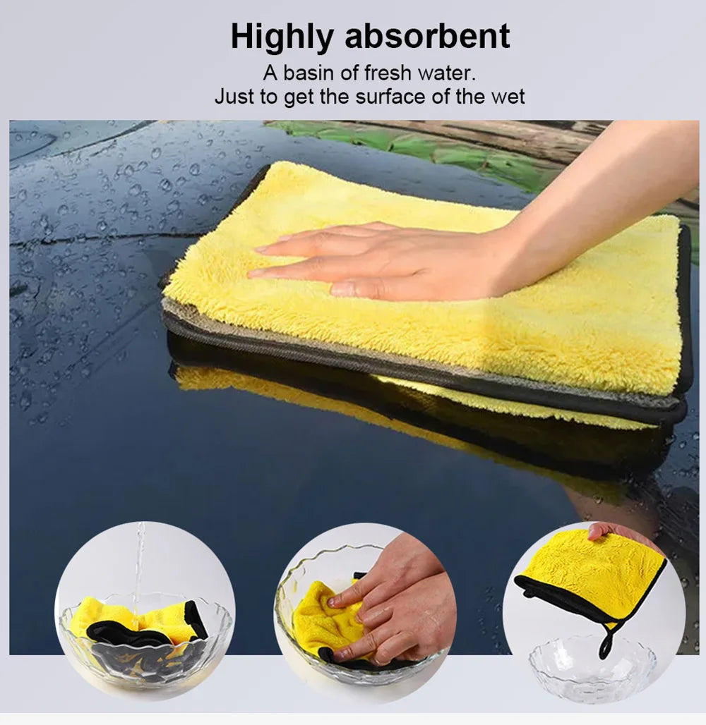 A yellow highly absorbent microfiber washing towel soaking up water on a dark surface.