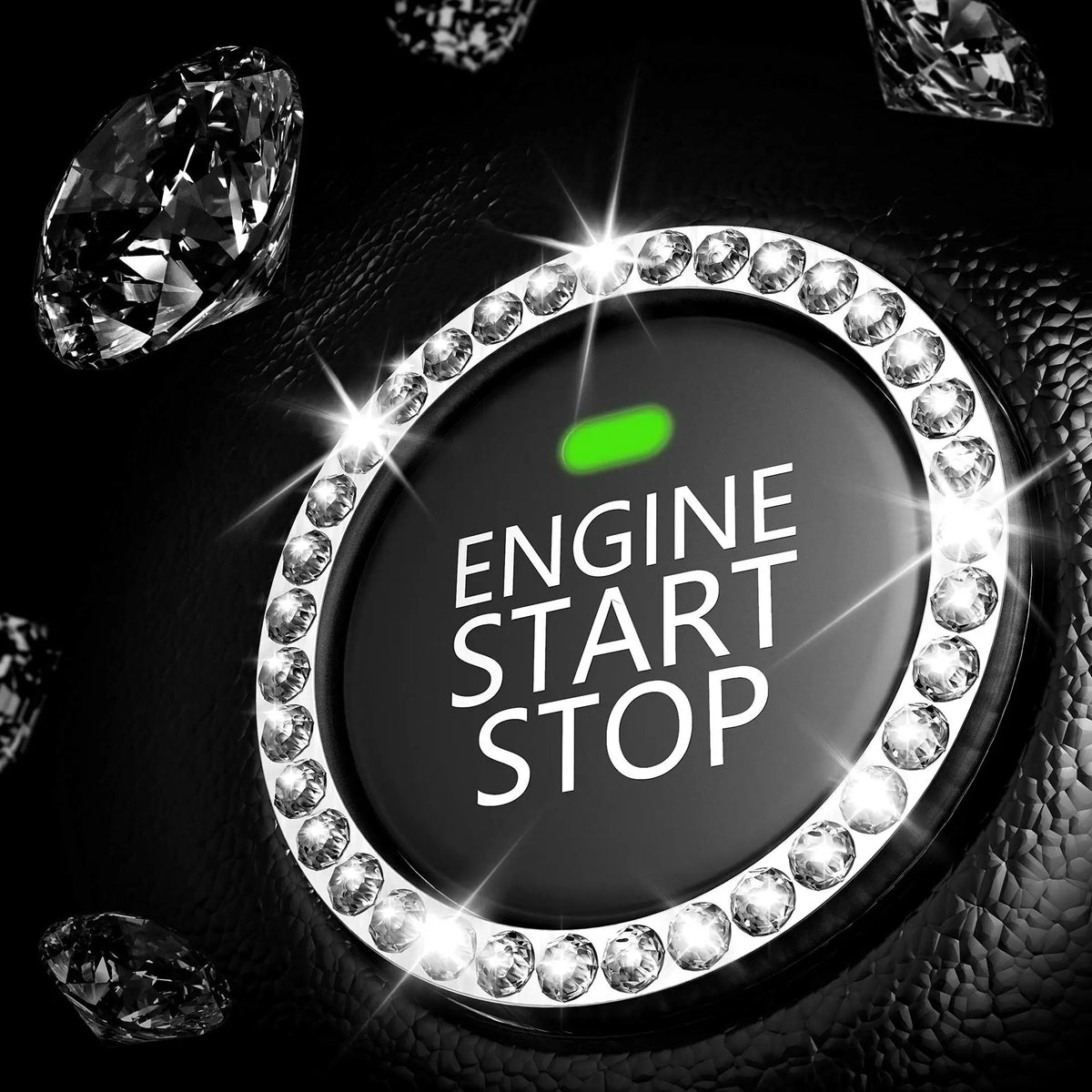 A close-up of a decorative ignition push button cover featuring a circular arrangement of clear rhinestones and a green light