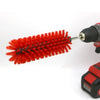 A close-up of a red drill brush designed for cleaning wheels and tires.