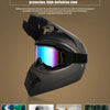 A black off-road safety helmet with colorful goggles is shown against a neutral background.