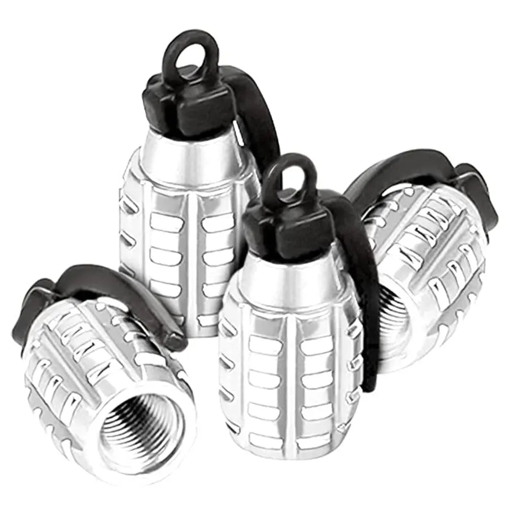 A set of four silver and black aluminum tire valve caps for automotive use.