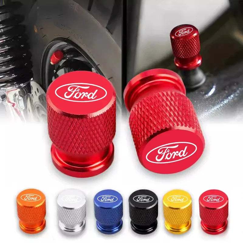 A collection of various colored and finish aluminum car wheel valve caps for different vehicle applications.
