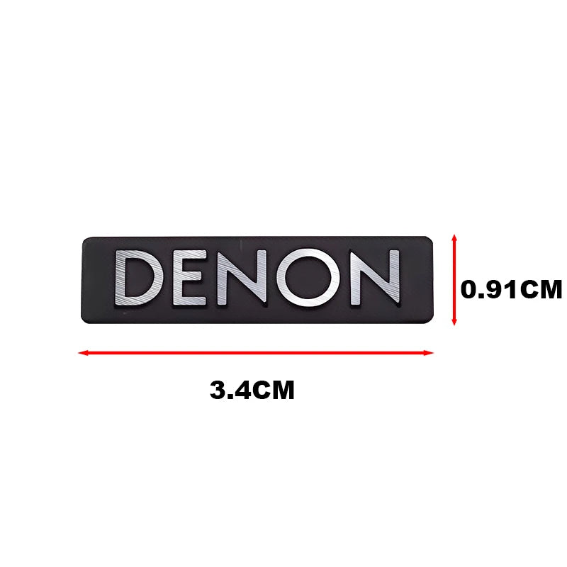 Black DENON car audio emblem measuring 3.4cm long and 0.91cm high