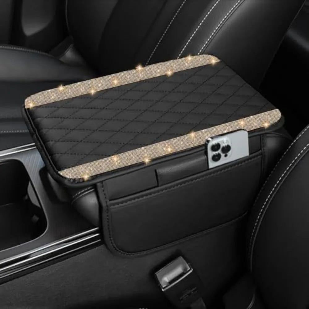 A black car console cover with a diamond grid pattern and illuminated accents resting in a luxury leather interior.