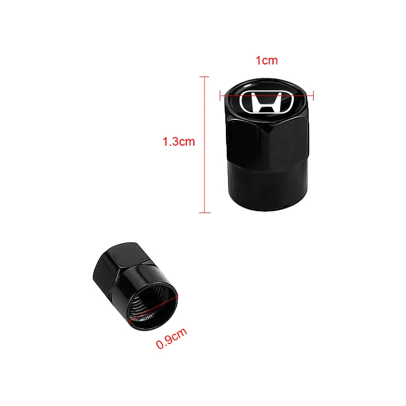A set of black anodized tire valve caps shown with dimensions, including a 1cm height and 0.9cm diameter.