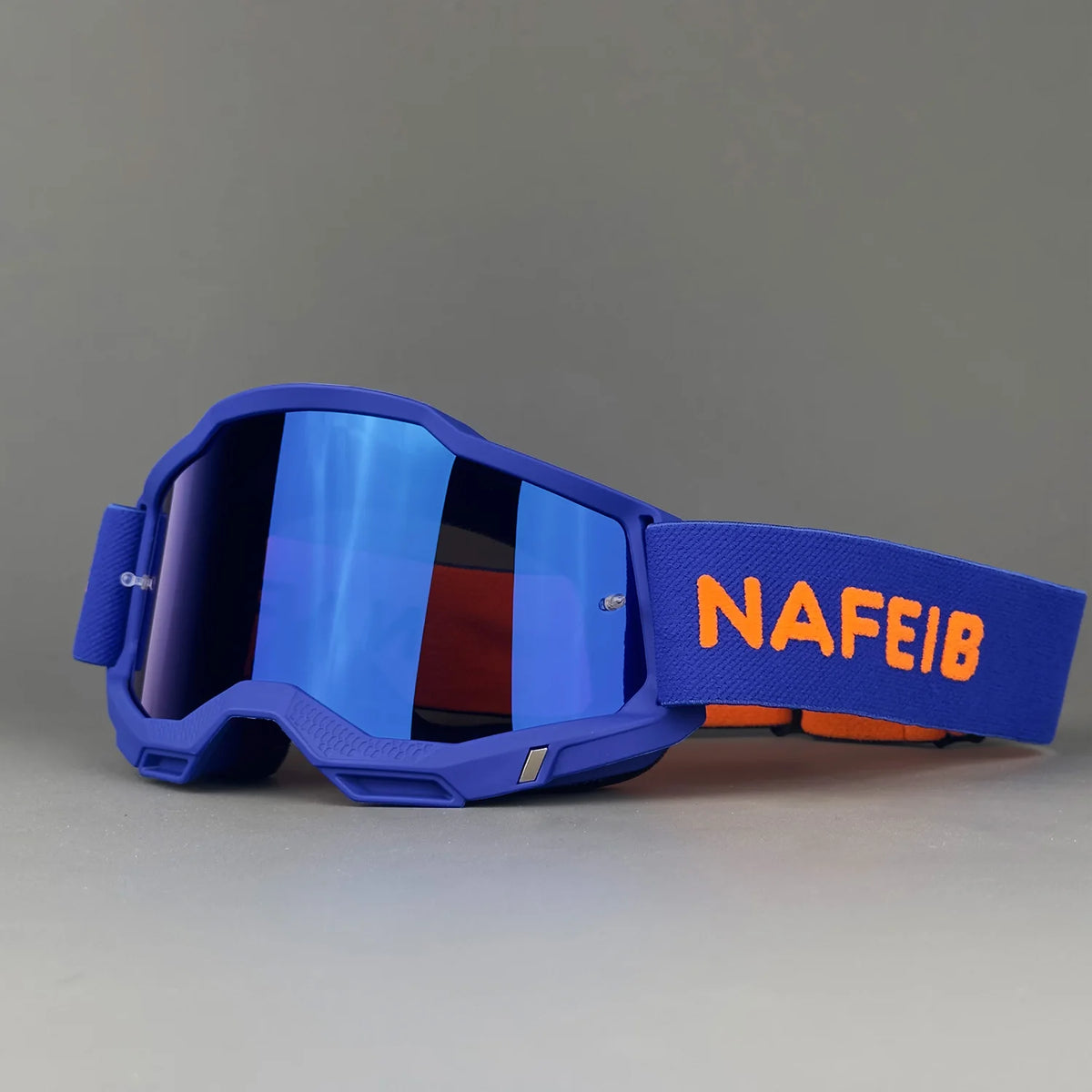 A pair of blue off-road racing goggles with an orange strap and a reflective lens.