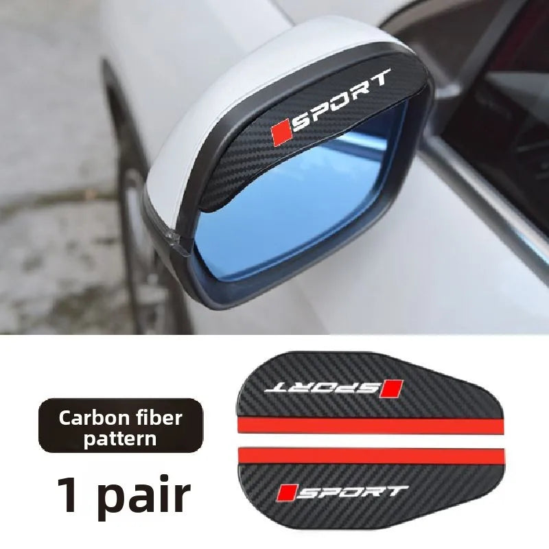 A pair of black carbon fiber sport side mirror rain deflectors installed on a white car.